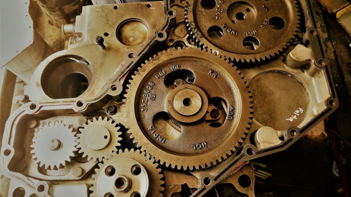 Detailed view of interconnected gears showcasing engineering precision and technology in a workshop.