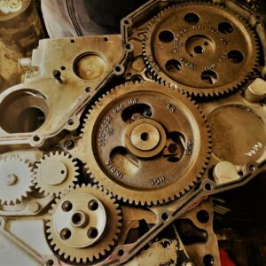 Detailed view of interconnected gears showcasing engineering precision and technology in a workshop.
