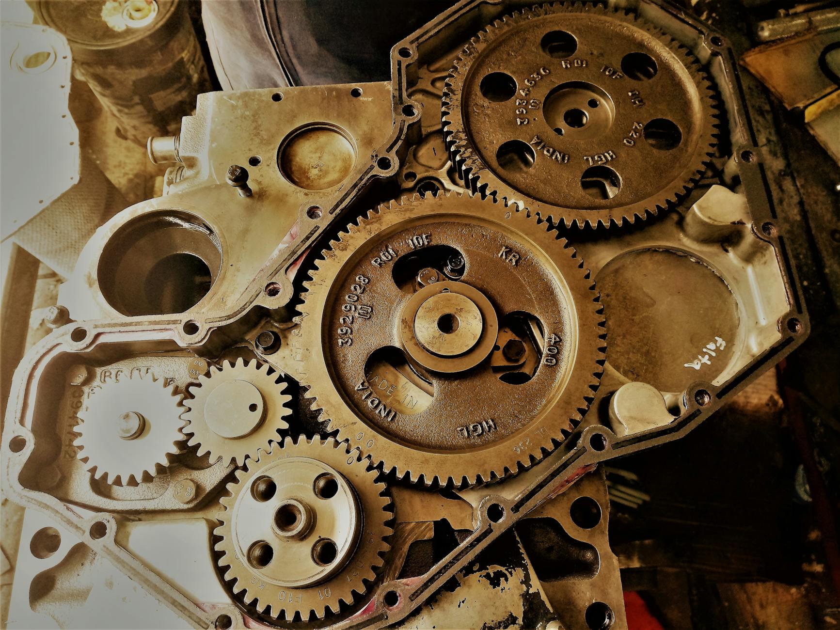 Detailed view of interconnected gears showcasing engineering precision and technology in a workshop.
