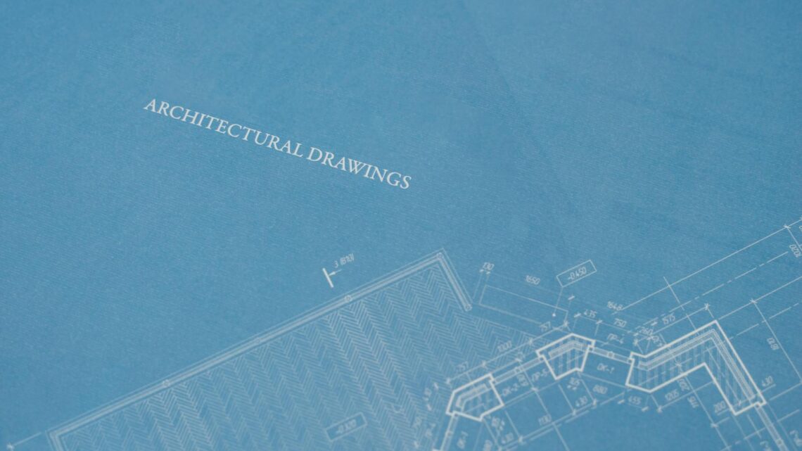 Close-up view of architectural blueprint with technical drawings.