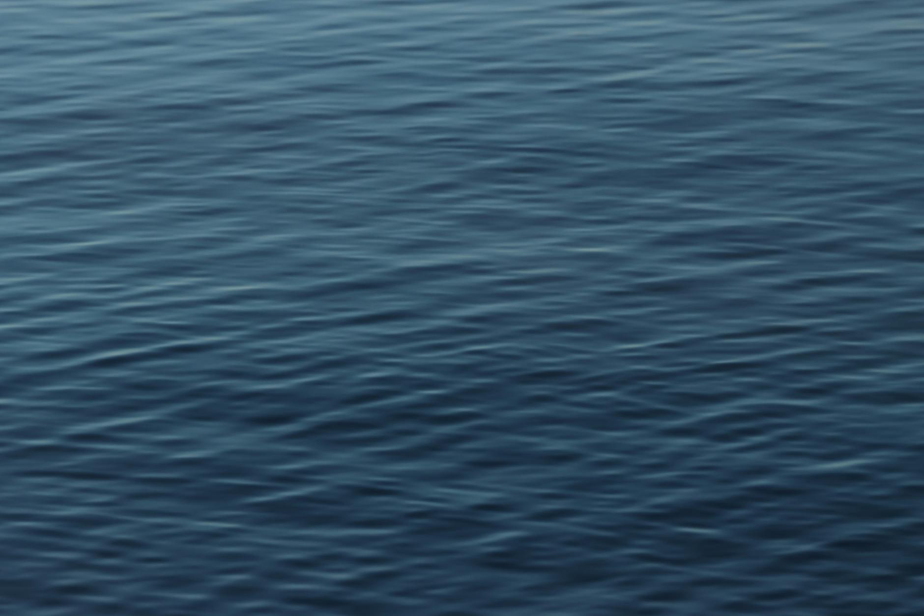 Calm and rippled water surface in Jönköping, highlighting serene nature.