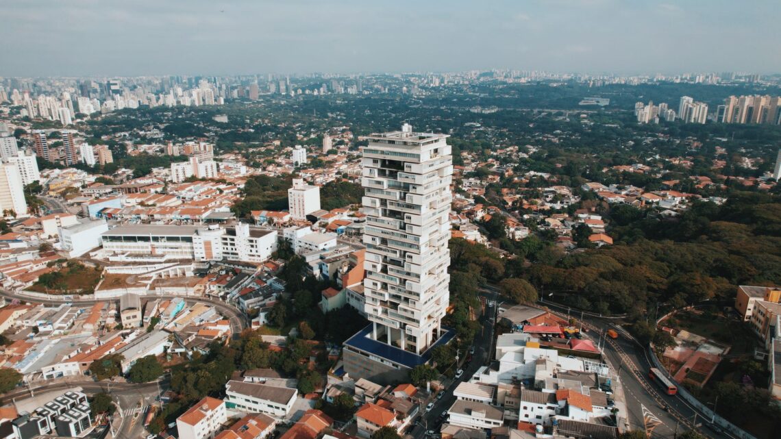 High-angle aerial shot of São Paulo showcasing urban architecture and greenery.