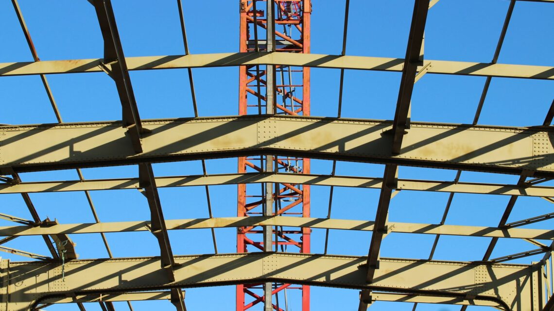 View of a steel construction framework under clear blue sky in the Netherlands.