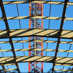 View of a steel construction framework under clear blue sky in the Netherlands.
