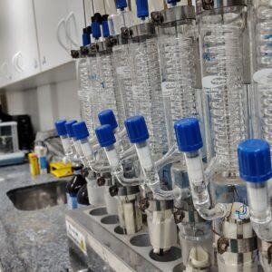 Image of a laboratory setup with glass condensers and lab equipment on the countertop.