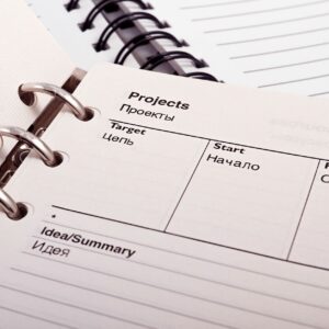 Open planner displaying project schedule with Russian-English text, ideal for office or educational content.