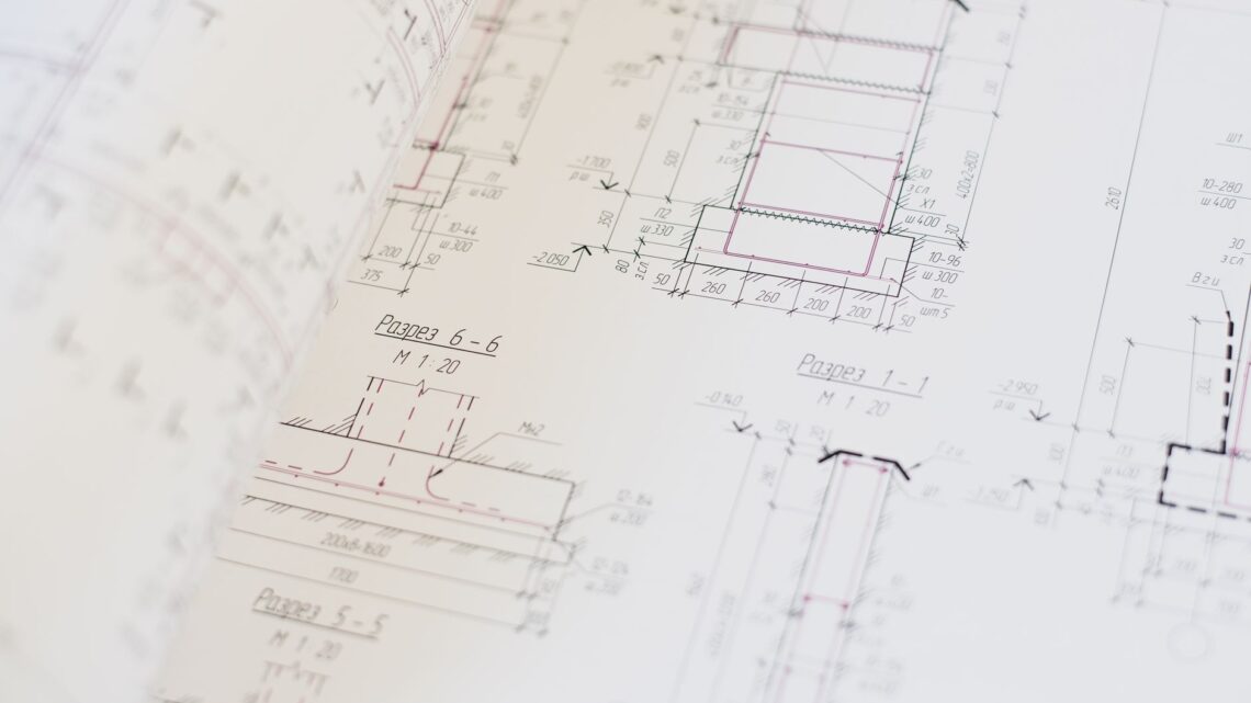 Close-up of a detailed architectural blueprint showcasing design and planning.