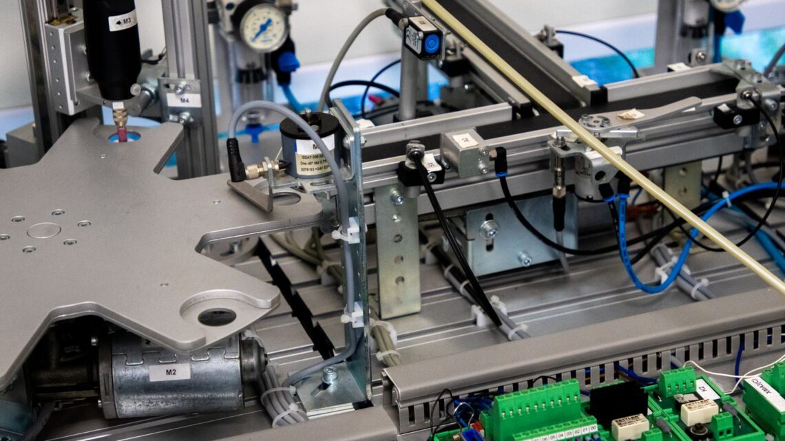 Close-up of advanced machinery showcasing robotic automation and precision engineering.