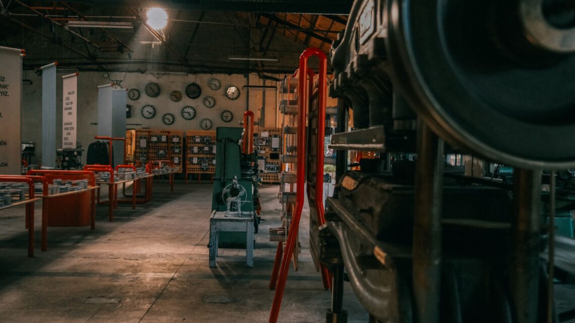 A rustic industrial workshop filled with vintage machinery and tools.
