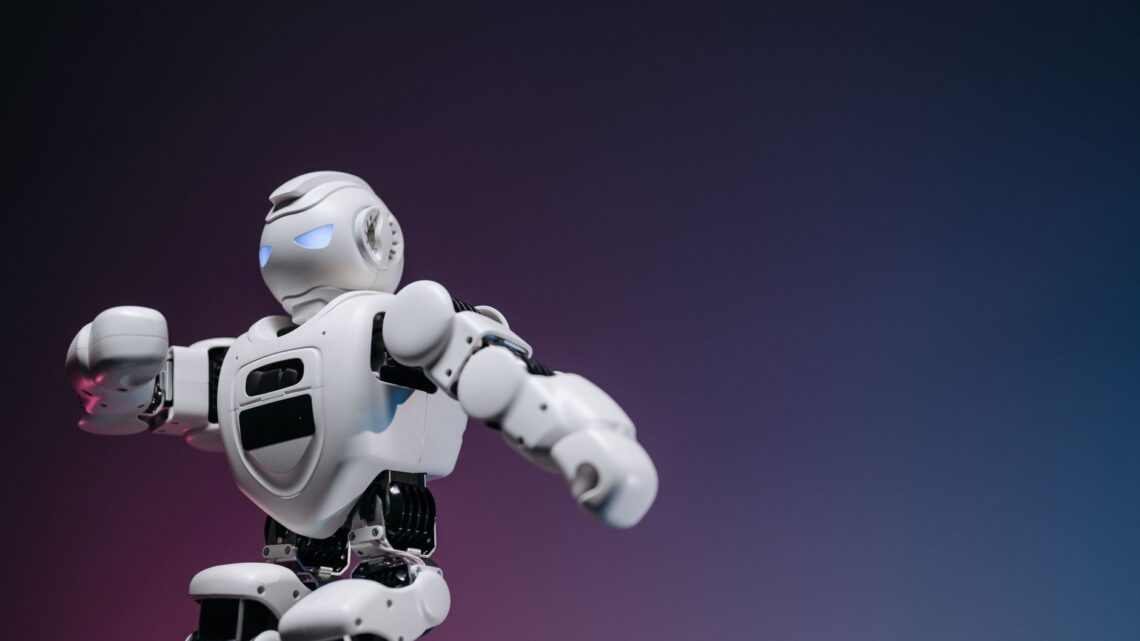 Close-up of a futuristic robotic toy against a gradient background, symbolizing innovation and technology.